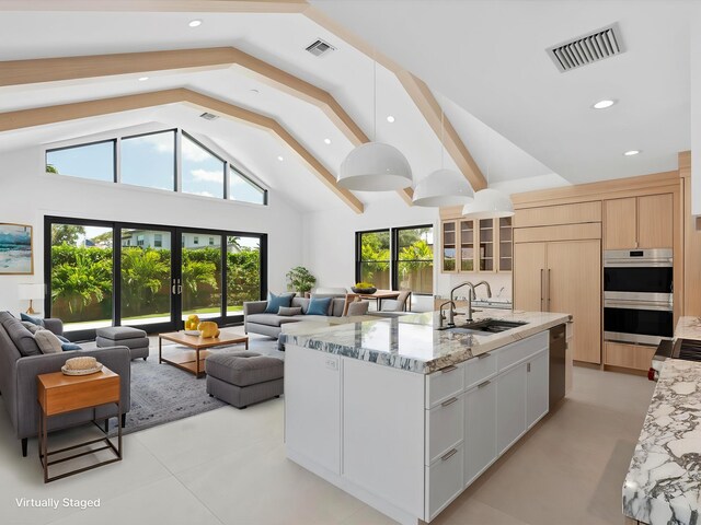 8 Leeward Cir, Tequesta, FL 33469 - kitchen featuring stainless steel double oven, a sink, open floor plan, dishwashing machine, and recessed lighting