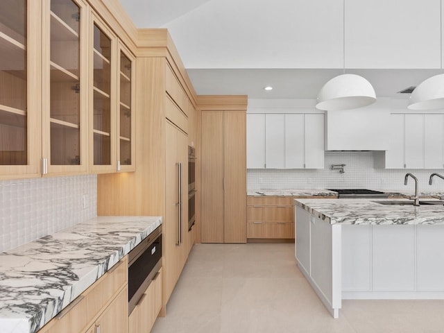 8 Leeward Cir, Tequesta, FL 33469 - kitchen featuring a sink, decorative backsplash, light stone countertops, appliances with stainless steel finishes, and recessed lighting
