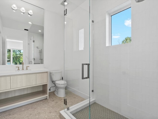 8 Leeward Cir, Tequesta, FL 33469 - bathroom with a stall shower, toilet, vanity, and baseboards