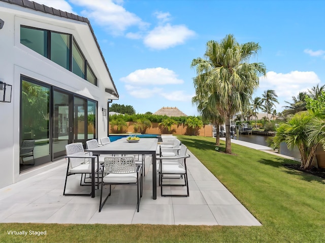 8 Leeward Cir, Tequesta, FL 33469 - view of patio with a water view and outdoor dining space