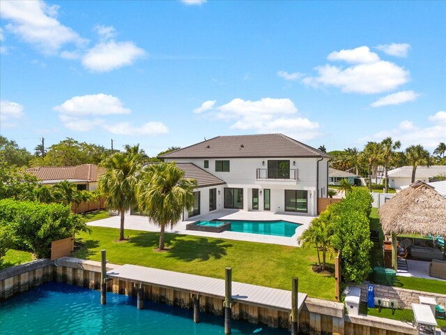 8 Leeward Cir, Tequesta, FL 33469 - back of property with a balcony, a gazebo, a patio, a lawn, and a pool with connected hot tub