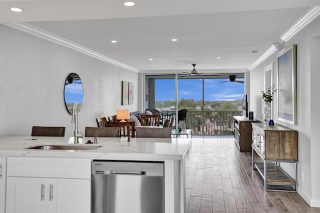 3100 S Ocean Blvd Unit 620, Highland Beach, FL 33487 - kitchen with stainless steel dishwasher, ornamental molding, wood finished floors, a ceiling fan, and a sink