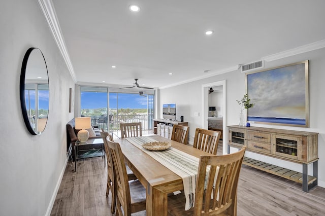 3100 S Ocean Blvd Unit 620, Highland Beach, FL 33487 - dining room with crown molding, baseboards, a ceiling fan, wood finished floors, and recessed lighting