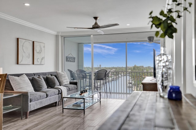 3100 S Ocean Blvd Unit 620, Highland Beach, FL 33487 - living room with a wall of windows, a ceiling fan, ornamental molding, and wood finished floors