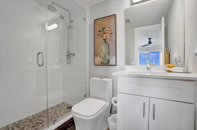 3100 S Ocean Blvd Unit 620, Highland Beach, FL 33487 - full bathroom featuring a stall shower, vanity, toilet, and ceiling fan
