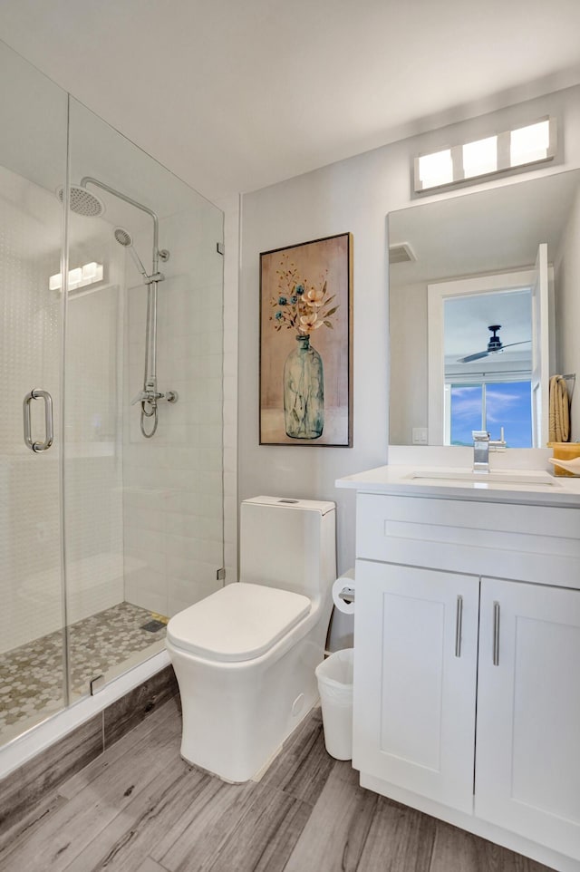 3100 S Ocean Blvd Unit 620, Highland Beach, FL 33487 - bathroom with wood finished floors, toilet, and a stall shower