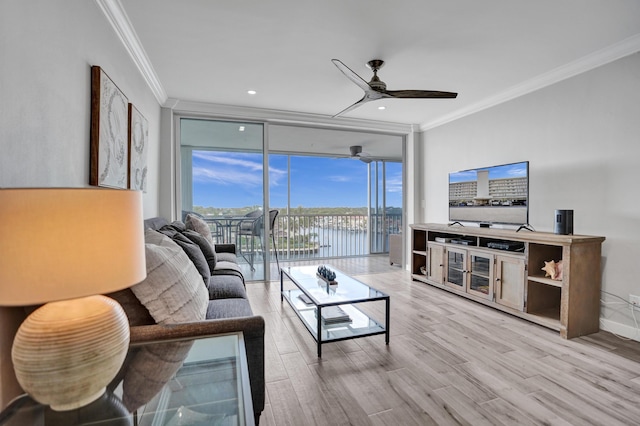 3100 S Ocean Blvd Unit 620, Highland Beach, FL 33487 - living room with crown molding, floor to ceiling windows, a ceiling fan, and wood finished floors