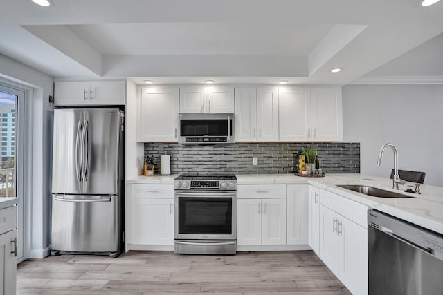 3100 S Ocean Blvd Unit 620, Highland Beach, FL 33487 - kitchen featuring stainless steel appliances, a sink, recessed lighting, light stone counters, and backsplash