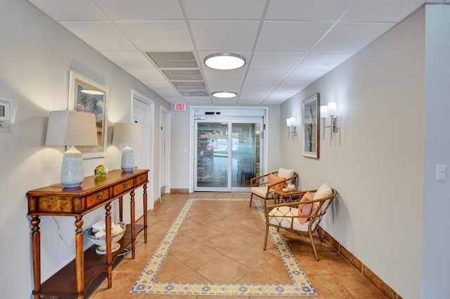 3100 S Ocean Blvd Unit 620, Highland Beach, FL 33487 - hall with baseboards, light tile patterned floors, a paneled ceiling, and inlaid floor details