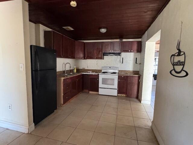 kitchen featuring white electric range, freestanding refrigerator, light tile patterned flooring, a sink, and wooden ceiling