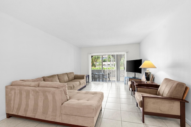 250 NE 20th St Unit 1220, Boca Raton, FL 33431 - living room featuring light tile patterned floors and baseboards
