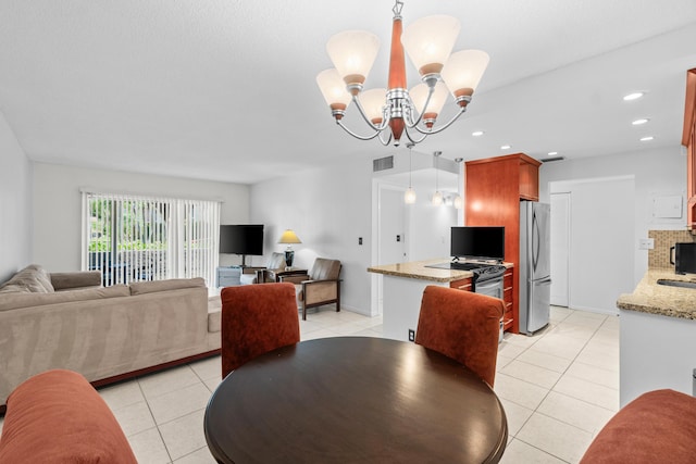 250 NE 20th St Unit 1220, Boca Raton, FL 33431 - dining room with light tile patterned floors, a chandelier, and recessed lighting