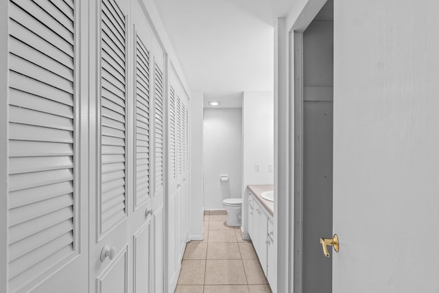 250 NE 20th St Unit 1220, Boca Raton, FL 33431 - bathroom featuring a closet, toilet, vanity, tile patterned flooring, and recessed lighting