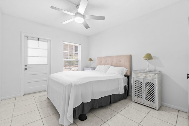 250 NE 20th St Unit 1220, Boca Raton, FL 33431 - tiled bedroom with baseboards and a ceiling fan