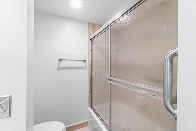 250 NE 20th St Unit 1220, Boca Raton, FL 33431 - bathroom with toilet, shower / bath combination with glass door, and tile patterned floors