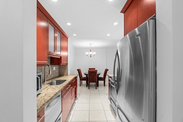 250 NE 20th St Unit 1220, Boca Raton, FL 33431 - kitchen with a sink, appliances with stainless steel finishes, backsplash, recessed lighting, and light stone counters