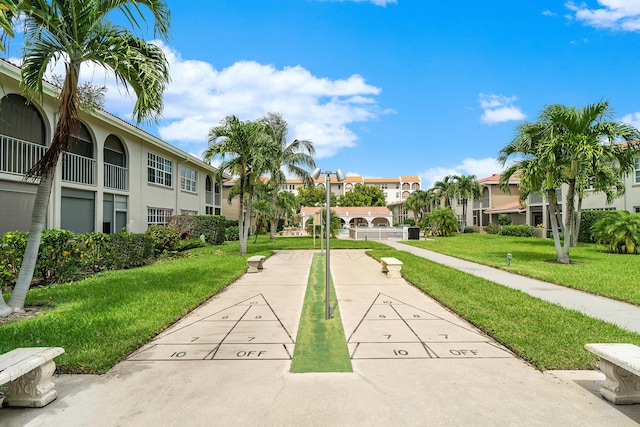 250 NE 20th St Unit 1220, Boca Raton, FL 33431 - surrounding community featuring a residential view, a yard, and shuffleboard