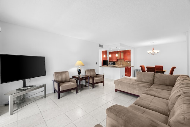 250 NE 20th St Unit 1220, Boca Raton, FL 33431 - living room with a chandelier and light tile patterned flooring