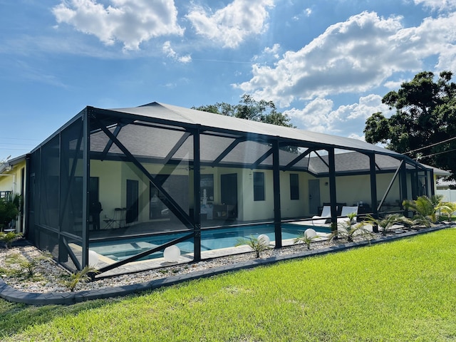 1601 SW California Blvd, Port Saint Lucie, FL 34953 - back of house featuring an outdoor pool, a lawn, a patio, and a lanai