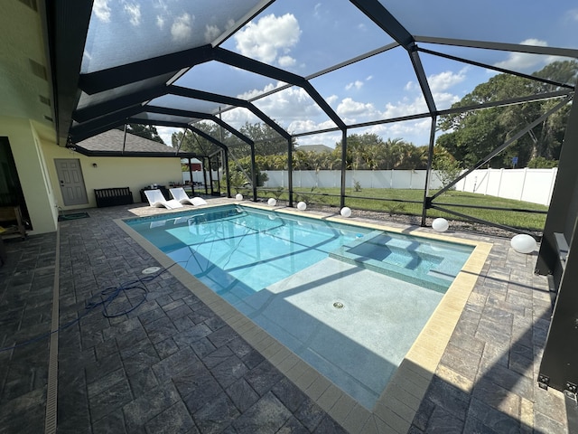 1601 SW California Blvd, Port Saint Lucie, FL 34953 - view of swimming pool featuring a patio area, a fenced backyard, and glass enclosure