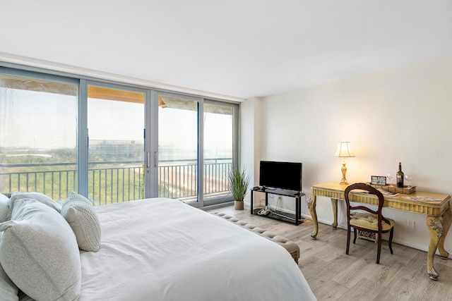 1180 S Ocean Blvd Unit 7B, Boca Raton, FL 33432 - bedroom featuring access to outside and wood finished floors