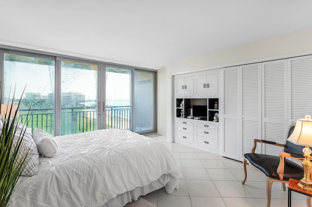 1180 S Ocean Blvd Unit 7B, Boca Raton, FL 33432 - bedroom featuring access to exterior, french doors, and light tile patterned floors