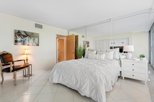 1180 S Ocean Blvd Unit 7B, Boca Raton, FL 33432 - bedroom featuring light tile patterned flooring and baseboards