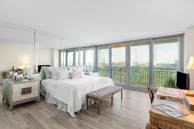 1180 S Ocean Blvd Unit 7B, Boca Raton, FL 33432 - bedroom with access to outside and light wood-style floors
