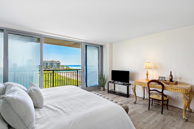 1180 S Ocean Blvd Unit 7B, Boca Raton, FL 33432 - bedroom featuring access to outside, light wood finished floors, baseboards, and expansive windows