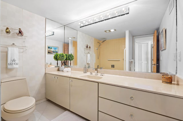 1180 S Ocean Blvd Unit 7B, Boca Raton, FL 33432 - bathroom featuring toilet, tile patterned floors, and vanity