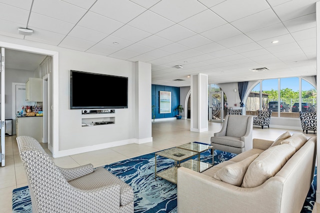 1180 S Ocean Blvd Unit 7B, Boca Raton, FL 33432 - living room featuring light tile patterned floors, baseboards, and a drop ceiling