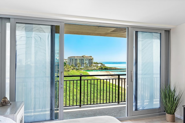 1180 S Ocean Blvd Unit 7B, Boca Raton, FL 33432 - doorway featuring a water view and plenty of natural light