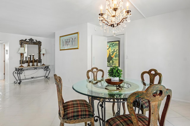 1180 S Ocean Blvd Unit 7B, Boca Raton, FL 33432 - dining room featuring light tile patterned floors, a chandelier, and baseboards