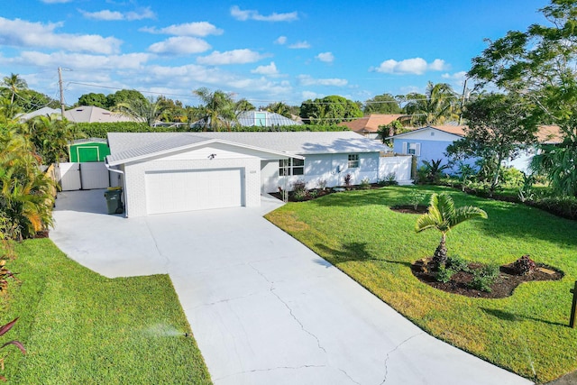 single story home with an attached garage, driveway, and a gate