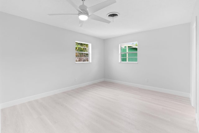 unfurnished room featuring light wood-style floors, ceiling fan, and baseboards