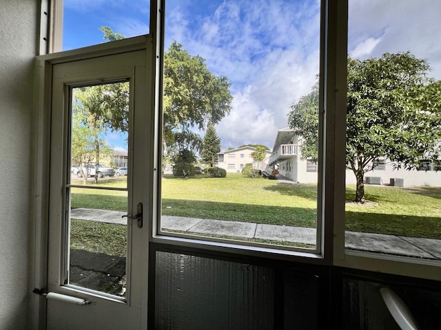 314 Chatham P, West Palm Beach, FL 33417 - doorway to outside featuring a textured wall