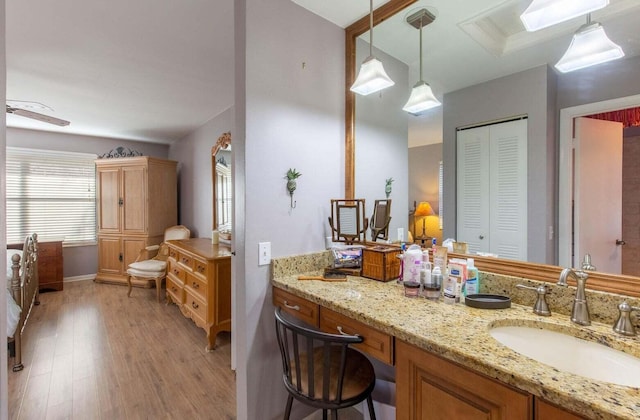 13045 Albright Ct Unit 12, Wellington, FL 33414 - bathroom with wood finished floors, a closet, vanity, and baseboards