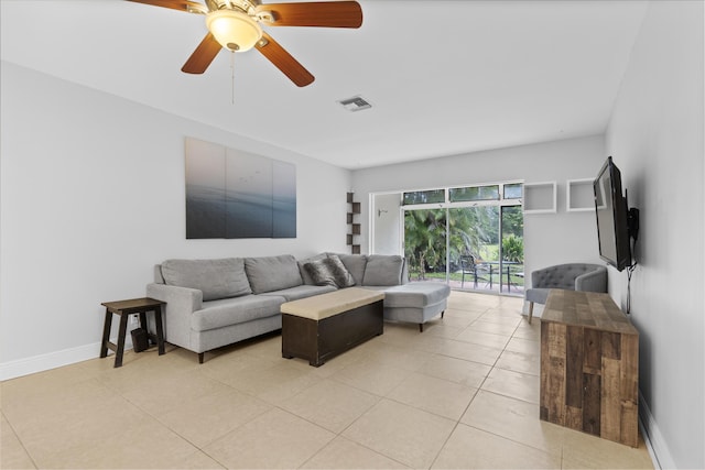 1920 Palmland Dr Unit C, Boynton Beach, FL 33436 - living area featuring light tile patterned floors, baseboards, and ceiling fan