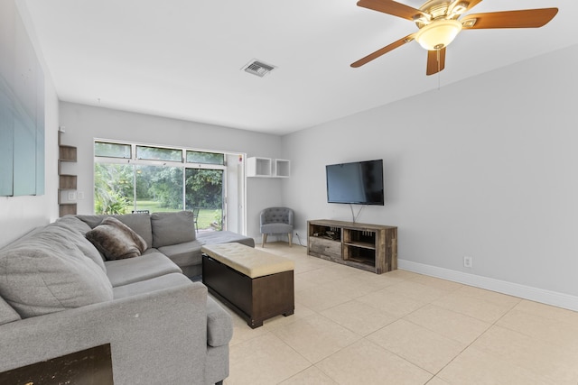 1920 Palmland Dr Unit C, Boynton Beach, FL 33436 - living room with light tile patterned floors, a ceiling fan, and baseboards