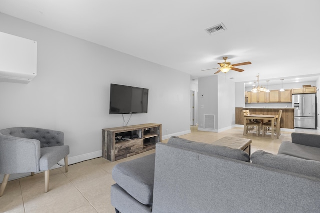 1920 Palmland Dr Unit C, Boynton Beach, FL 33436 - living area featuring light tile patterned floors, a ceiling fan, and baseboards