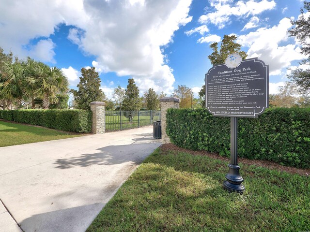 11416 SW Lake Park Dr, Port Saint Lucie, FL 34987 - exterior view of fence, driveway, and a gate