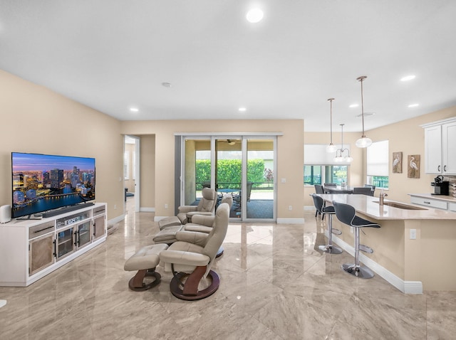 11416 SW Lake Park Dr, Port Saint Lucie, FL 34987 - living area featuring light marble finish flooring, baseboards, and recessed lighting