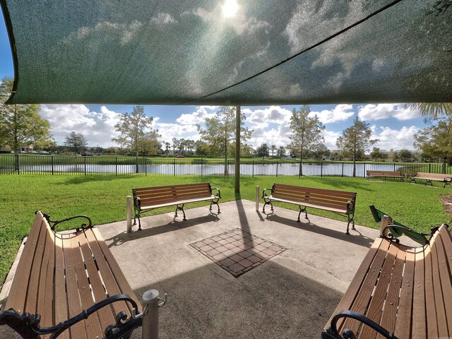 11416 SW Lake Park Dr, Port Saint Lucie, FL 34987 - view of property's community with a patio area and a water view