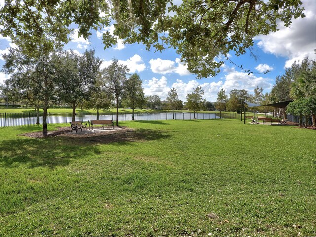 11416 SW Lake Park Dr, Port Saint Lucie, FL 34987 - view of yard with a water view