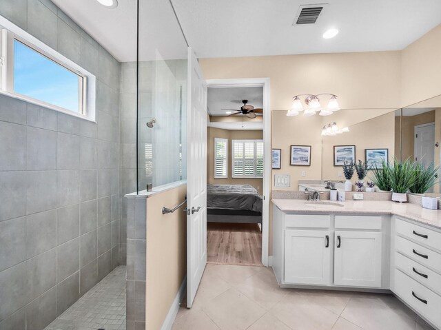 11416 SW Lake Park Dr, Port Saint Lucie, FL 34987 - ensuite bathroom featuring a ceiling fan, a walk in shower, vanity, tile patterned flooring, and recessed lighting