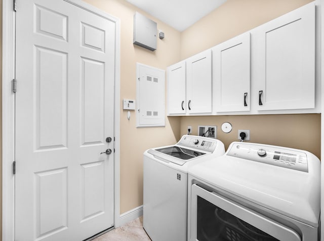 11416 SW Lake Park Dr, Port Saint Lucie, FL 34987 - clothes washing area with cabinet space, washer and clothes dryer, and baseboards