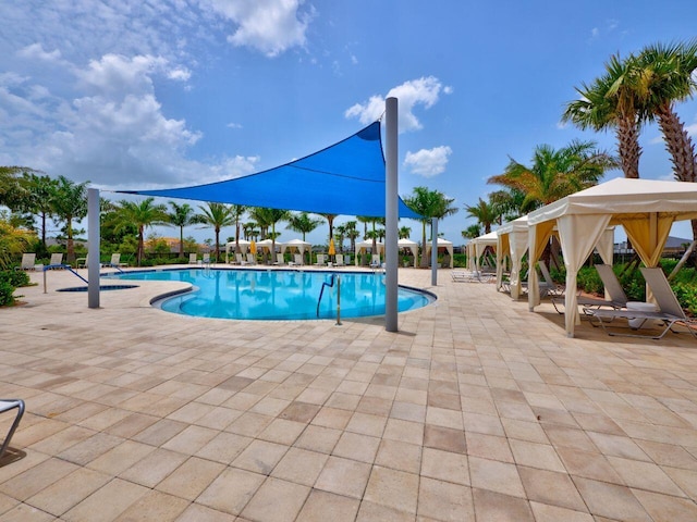 11416 SW Lake Park Dr, Port Saint Lucie, FL 34987 - community pool featuring a patio area and a gazebo