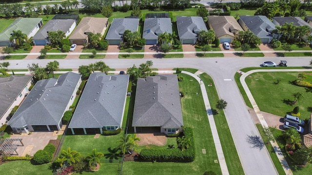 11416 SW Lake Park Dr, Port Saint Lucie, FL 34987 - aerial view of property and surrounding area with nearby suburban area