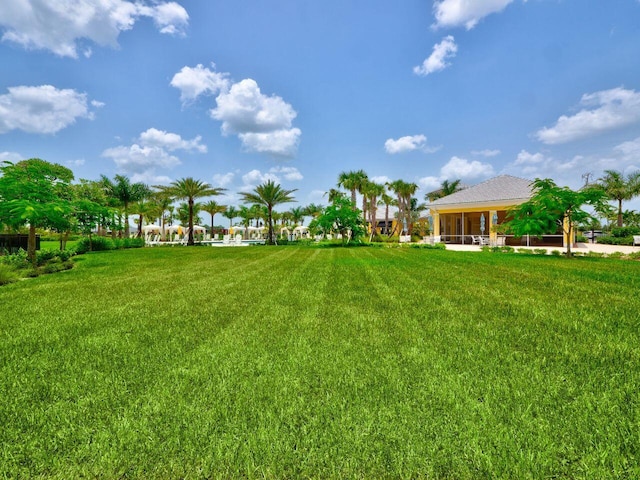 11416 SW Lake Park Dr, Port Saint Lucie, FL 34987 - view of green lawn featuring a sunroom