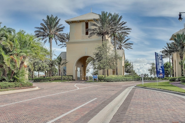 11416 SW Lake Park Dr, Port Saint Lucie, FL 34987 - view of decorative road featuring curbs and street lighting